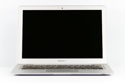 Front view of a MacBook Air laptop with a blank screen on a white background.